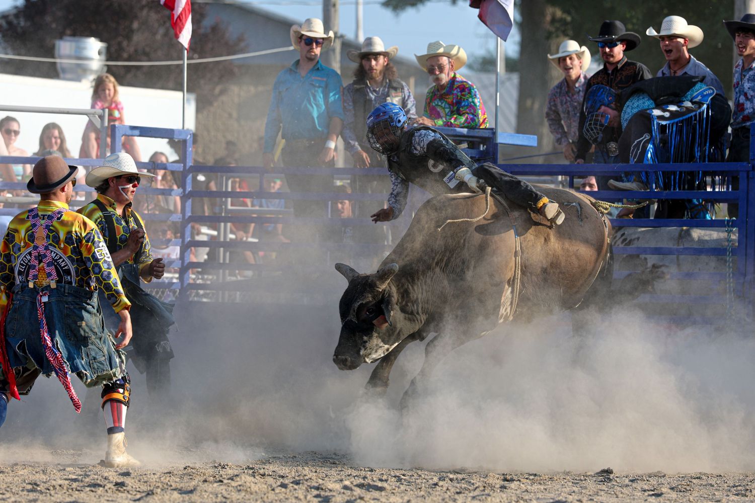 Bullfighters stepping in during a rodeo ride